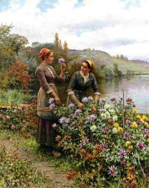 Two women cutting flowers in the garden